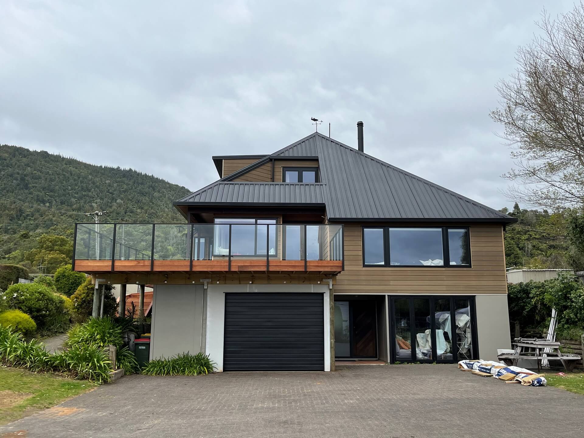 Lake Rotoiti home upgrade with Cedar re-clad, new windows, new roof, kitchen and bathrooms.